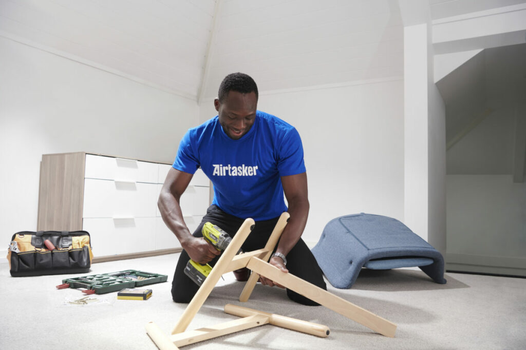 a picture of a person completing a task wearing an AirTasker uniform