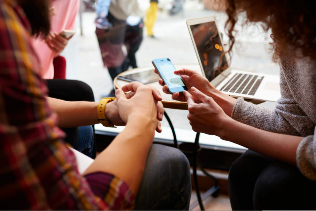 Over 64% of Gen Z and Millennials (like the young people depicted here) have made a purchase through social media in the past year reveals recent data by Snap Inc. and Havas Media Network.