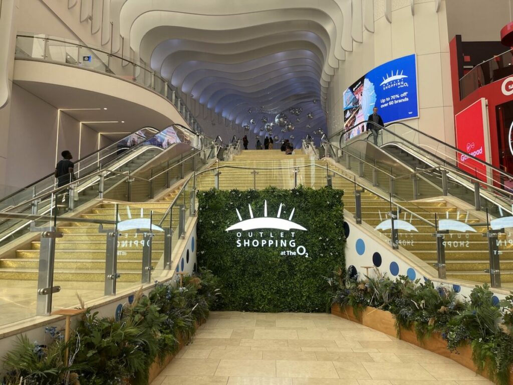 London destination The O2 has announced a revision of its outlet shopping brand, simplifying 'Icon Outlet at The O2' to 'Outlet Shopping at The O2', here depicting the new name and logo
