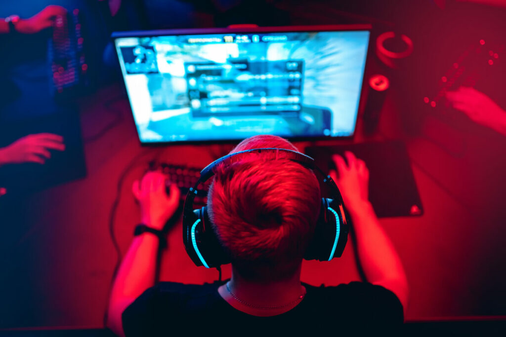 Image showing gamer gaming online. The ASA has banned two paid-for Facebook ads for the mobile app game Golf Clash owned by EA Limited (Electronic Arts Limited), upholding a complaint which deemed the ads misleading because they "ommitted material information".