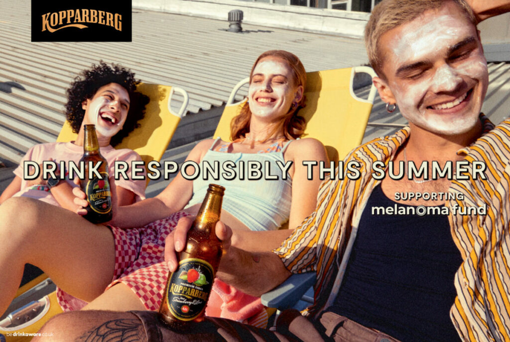 Young people slathered in suncream on sun loungers drinking in the sun. Koppaberg has partnered with charity Melanoma Fund, in order to encourage consumers to drink responsibly in the sun this summer.