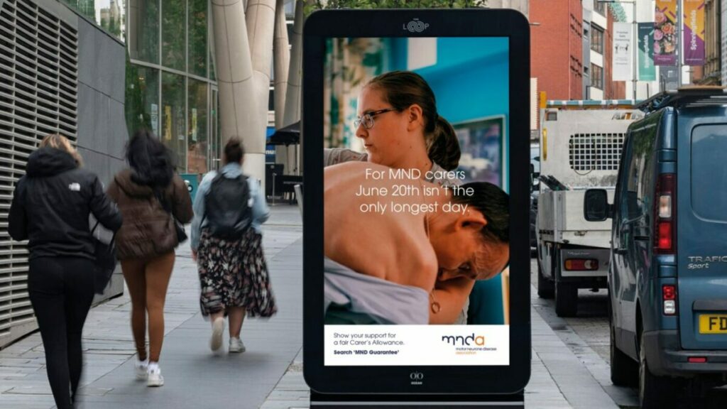 Billboard reading "For MND carers June 20th isn't the only longest day". MND Association billboards reading "The MND Association is using the longest day of the year to highlight that every day is the longest day of the year for hard-working carers.