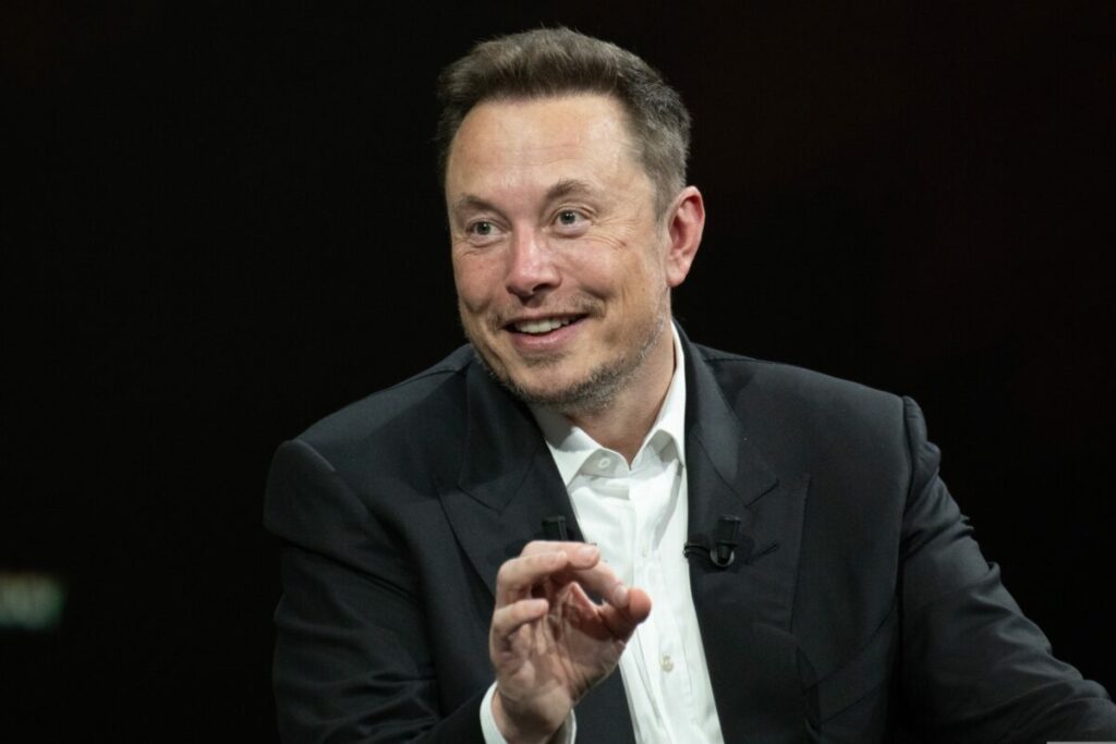 Elon Musk mid speech. Elon Musk is flying to Cannes in an effort to win back advertisers, despite being known for his staunch criticism of them.