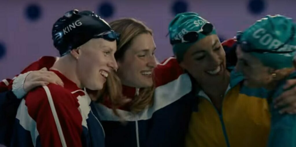 Three swimmers come together to hug each other. Coca-Cola focuses on the act of coming together in its new Olympics spot, which shows how supporters and community can spur on athletes and drive success.
