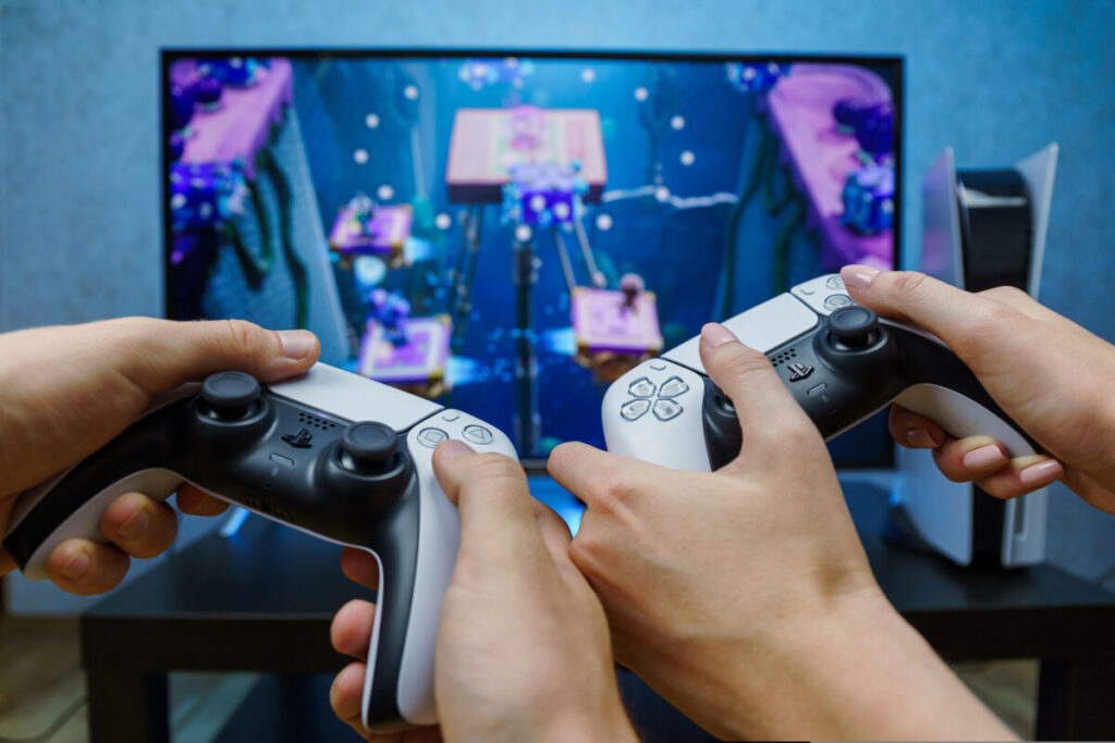 Two people gaming. Consumer goods giant Unilever has reportedly tripled its spending on in-game advertising for brands including Lynx and Dove over the past three years.