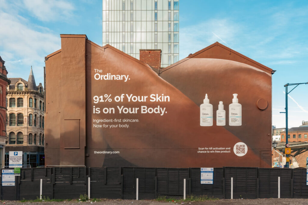 The new mural showing off three products. The Ordinary's new mural, created by One Agency, includes a QR code which allows the user to access key information about each of the products.