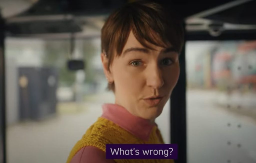 Actress Em Pendergast wears a yellow vest over a pink jumper as she stars in Scope's new video while signing. Set to the sound of The Chemical Brothers' dance track 'Galvanise', Scope's new advert highlights the inequality still faced by disabled people.