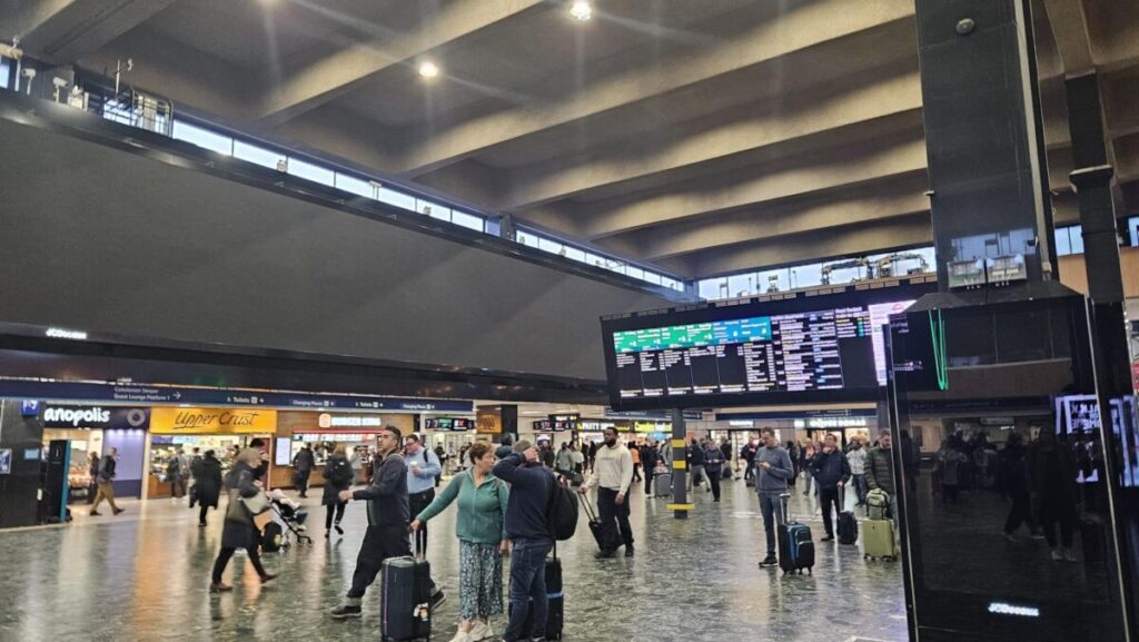 Passengers in Euston Station. Adfree Cities is calling for a permanent ban of Euston's billboards after it has turned them off as it reviews passenger safety at the station.