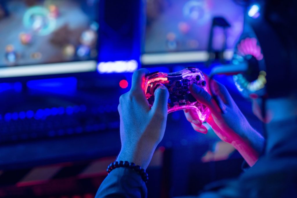 Gamer playing at home. Dentsu's State of Gaming report reveals that while gaming is worth more than music and film combined, ad spend is still low - at just 5% in the US.