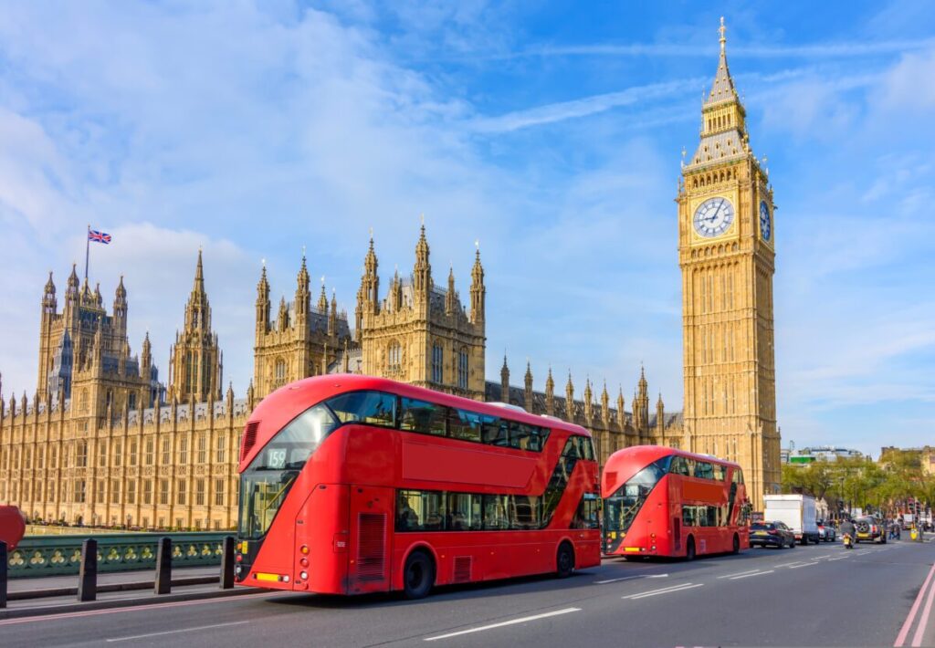 Buses pass by the houses of parliament on a sunny but slightly cloudy day. Leo Burnett's latest PopPulse report takes the temperature of the nation just 100 days into the new government. Cost of living and the NHS are among the key concerns of Brits.