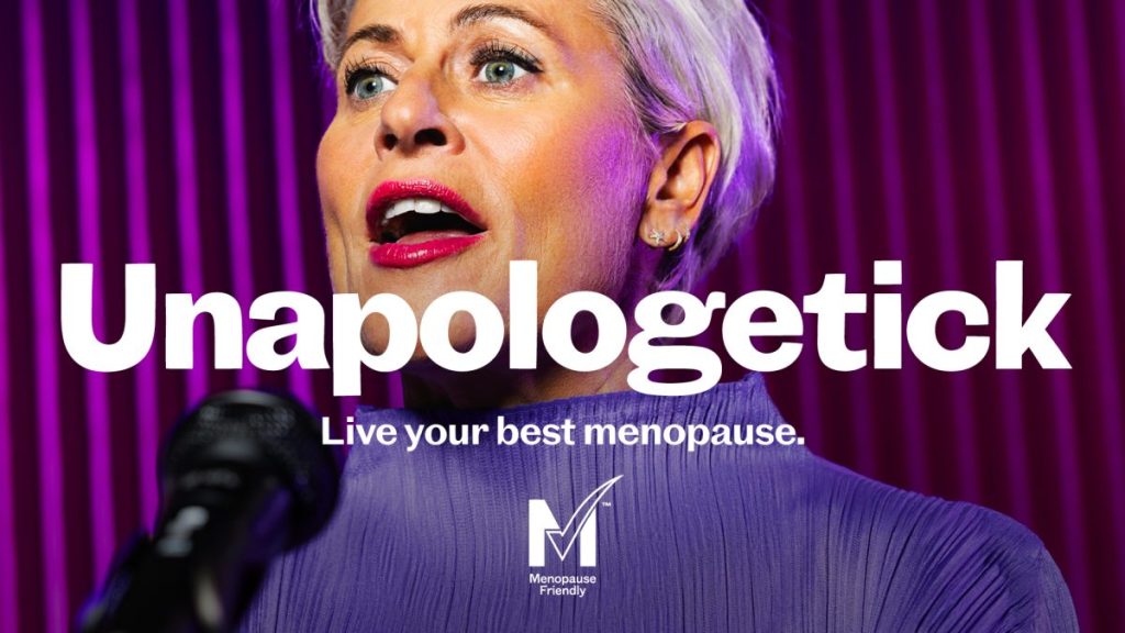 A woman at a microphone with red lipstick and white hair. Text reads Unapologetik. Propaganda Brand Consultancy joins forces with menopause product marketplace GenM to draw attention to put a positive spin on the menopause.